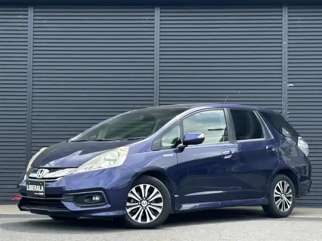 ホンダ フィット シャトル ハイブリッド スマートセレ クールED 茨城県 2014(平26)年 12.6万km プレミアムブルームーンパール 純正ナビ　/ＴＶ　/ＢＴ　/ＤＶＤ　/ＣＤ　/バックカメラ　/ハーフレザーシート　/シートヒーター　/ＥＴＣ　/ドラレコ　/オートライト　/オートエアコン　/フロアマット　/純正１５インチアルミホイール　/禁煙車