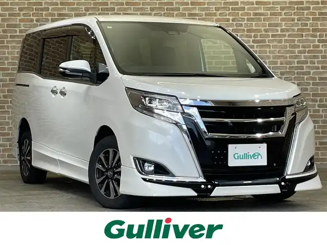 トヨタ エスクァイア Gi プレミアムパッケージ 岩手県 2018(平30)年 8.9万km ホワイトパールクリスタルシャイン ４WD/TRDスポイラー/ALPINE後席モニター/ALPINE９インチナビ/寒冷地仕様/両側パワースライドドア/トヨタセーフティセンスC/プリクラッシュセーフティ/レーンディパーチャーアラート/オートマチックハイビーム/先行車発進告知機能/クルーズコントロール/横滑り防止装置/アイドリングストップ/MTモード付AT/シートヒーター/ステアリングヒーター/ロールサンシェード/リヤオートエアコン/エンジンスターター/バックカメラ/ドライブレコーダー/ETC/LEDヘッドランプ/純正１５インチアルミホイール