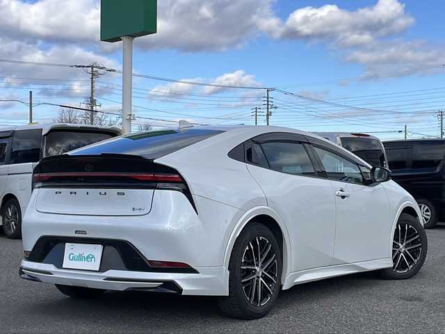 トヨタ プリウス Z 道央・札幌 2024(令6)年 3.6万km プラチナホワイトパールマイカ ワンオーナー/モデリスタ/純正ディスプレイオーディオ/【ＢＴ／ＨＤＭＩ／Ｍｉｒａｃａｓｔ／ＵＳＢ】/ワイアレス充電/パノラミックビューモニター/デジタルインナーミラー/ＵＳＢ出力電源/ＡＣ１００Ｖ/トヨタプロアクティブドライビングシステム/プリクラッシュセーフティ/ブラインドスポットモニタリング/自動駐車アシスト/レーダークルーズコントロール/レーンディパーチャアラート/フロント／リアクロストラフィックアラート/リヤカメラディテクション/安心降車アシスト/後方車両接近通知/周辺車両接近時サポート/ロードサインアシスト/レーンチェンジアシスト/パーキングサポートブレーキ/革巻きステアリング/ステアリングスイッチ/ステアリングヒーター/レザーシート/運転席パワーシート/運転席シートメモリ/前席シートヒーター／エアシート/オートライト/オートハイビーム/ＬＥＤ/フォグランプ/フロントワイパーデアイサー/レインセンサー/ドアミラーヒーター/オート電動格納ミラー/ビルトインＥＴＣ/純正フロアマット/スペアキー