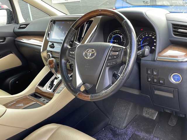 トヨタ アルファードハイブリット エグゼクティブ ラウンジ 道北・旭川 2017(平29)年 7.4万km ブラック /禁煙車//4WD//ワンオーナー//JBLプレミアムサウンドシステム（１７スピーカー）//ツインムーンルーフ//純正ナビ/ CD/DVD/BT/SD/USB/フルセグ//パノラミックビューモニター//純正フリップダウンモニター//セミアニリン革シート//パワーシート//シートヒーター//両側パワースライドドア//ステアリングヒーター//パワーバックドア//ミラーヒーター//助手席パワーオットマン//アクセサリーコンセント5個//リアサンシェード//プリクラッシュセーフティシステム//インテリジェントクリアランスソナー//レーダークルーズコントロール//オートハイビーム//オートライト//LEDヘッドライト//LEDフォグランプ//ドライブレコーダー//横滑り防止//保証書