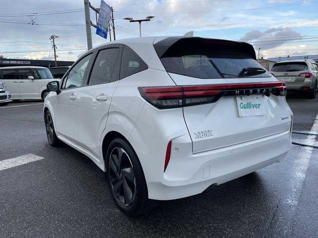 日産 オーラ G レザーエディション 新潟県 2023(令5)年 1.6万km ピュアホワイトパール ワンオーナー/純正ナビ（Bluetooth/DTV/FM/AM）/全周囲カメラ/BOSEプレミアムサウンド/プロパイロット/パーソナルディスプレイ/エマージェンシーブレーキ/コーナーセンサー/インナーバックミラー/ワイヤレス充電/VDC（ビークルダイナミクスコントロール）/LDW（車線免脱警報）/BSI（後側方衝突防止支援システム）/BSW（後側方車両検知警報）/ビルトインETC2.0/レザーシート/インテリジェントクルーズコントロール/SOSコール