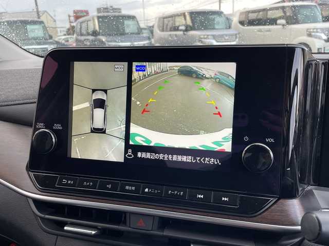 日産 オーラ G レザーエディション 新潟県 2023(令5)年 1.6万km ピュアホワイトパール ワンオーナー/純正ナビ（Bluetooth/DTV/FM/AM）/全周囲カメラ/BOSEプレミアムサウンド/プロパイロット/パーソナルディスプレイ/エマージェンシーブレーキ/コーナーセンサー/インナーバックミラー/ワイヤレス充電/VDC（ビークルダイナミクスコントロール）/LDW（車線免脱警報）/BSI（後側方衝突防止支援システム）/BSW（後側方車両検知警報）/ビルトインETC2.0/レザーシート/インテリジェントクルーズコントロール/SOSコール