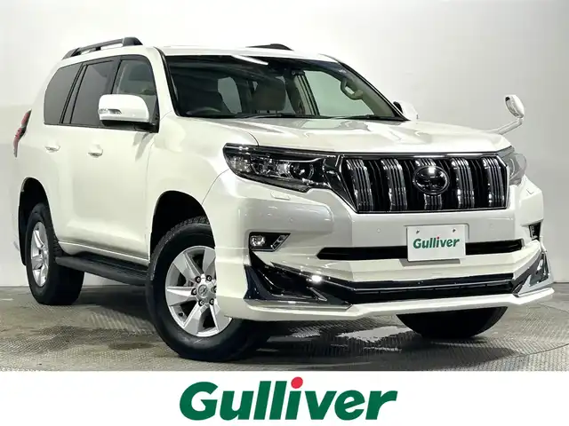 トヨタ ランドクルーザー プラド TX Lパッケージ 大阪府 2023(令5)年 1.7万km ホワイトパールクリスタルシャイン サンルーフ　革シート　社外エアロ　社外ディスプレイオーディオ　Ｂカメラ　パワーシート／ヒーター／エアコン　衝突軽減　レーダーＣ　クリアランスソナー　レーンアシスト　ルーフレール　前後ドラレコ　４ＷＤ