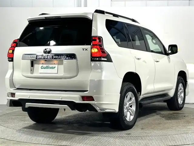 トヨタ ランドクルーザー プラド TX Lパッケージ 大阪府 2023(令5)年 1.7万km ホワイトパールクリスタルシャイン サンルーフ　革シート　社外エアロ　社外ディスプレイオーディオ　Ｂカメラ　パワーシート／ヒーター／エアコン　衝突軽減　レーダーＣ　クリアランスソナー　レーンアシスト　ルーフレール　前後ドラレコ　４ＷＤ