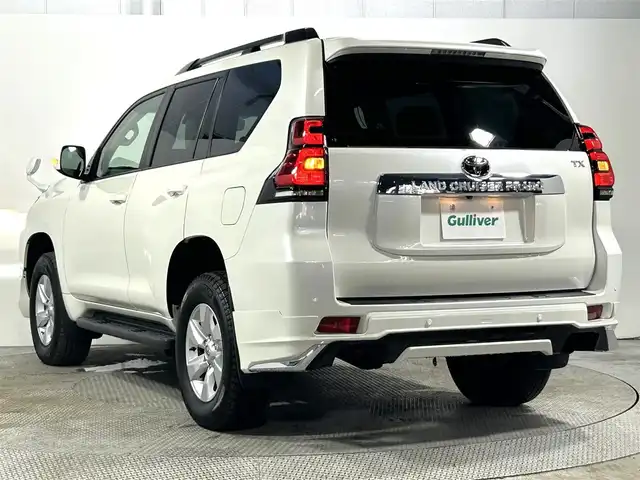 トヨタ ランドクルーザー プラド TX Lパッケージ 大阪府 2023(令5)年 1.7万km ホワイトパールクリスタルシャイン サンルーフ　革シート　社外エアロ　社外ディスプレイオーディオ　Ｂカメラ　パワーシート／ヒーター／エアコン　衝突軽減　レーダーＣ　クリアランスソナー　レーンアシスト　ルーフレール　前後ドラレコ　４ＷＤ