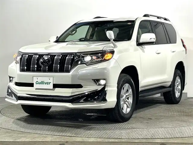 トヨタ ランドクルーザー プラド TX Lパッケージ 大阪府 2023(令5)年 1.7万km ホワイトパールクリスタルシャイン サンルーフ　革シート　社外エアロ　社外ディスプレイオーディオ　Ｂカメラ　パワーシート／ヒーター／エアコン　衝突軽減　レーダーＣ　クリアランスソナー　レーンアシスト　ルーフレール　前後ドラレコ　４ＷＤ