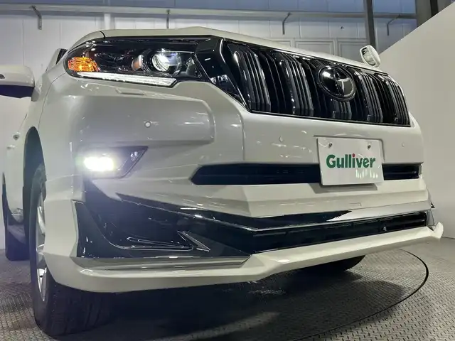 トヨタ ランドクルーザー プラド TX Lパッケージ 大阪府 2023(令5)年 1.7万km ホワイトパールクリスタルシャイン サンルーフ　革シート　社外エアロ　社外ディスプレイオーディオ　Ｂカメラ　パワーシート／ヒーター／エアコン　衝突軽減　レーダーＣ　クリアランスソナー　レーンアシスト　ルーフレール　前後ドラレコ　４ＷＤ