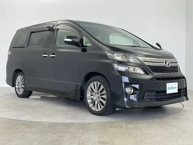 トヨタ ヴェルファイア 2．4Z ゴールデンアイズⅡ 鹿児島県 2014(平26)年 4.4万km ブラック ワンオーナー/アルパイン製ナビ/（CD/DVD/BT/フルセグ）/両側パワースライドドア/クルーズコントロール/アルパイン製フリップダウンモニター/パワーバックドア/コーナーセンサ―/ハーフレザーシート/オットマン/ドライブレコーダー/ビルトインETC/純正HIDヘッドライト/保証書/取扱説明書/スペアキー
