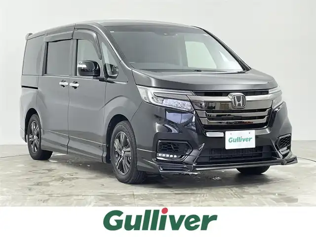 ホンダ ステップワゴン スパーダ eHEV G EXホンダS 千葉県 2020(令2)年 4.5万km プレミアムスパークルブラックパール 純正9インチナビ　VXM-207VFNi/フルセグTV　Bluetooth　CD/DVD/純正10インチフリップダウンモニター/バックカメラ/両側パワースライドドア/ETC2.0ビルトイン/オートライト/ハーフレザー/シートヒーター/ホンダセンシング/・衝突軽減ブレーキ/・レーンキープアシスト/・レーダークルーズコントロール/・誤発進抑制機能/・先行車お知らせ機能/・標識認識機能/コーナーセンサー/クリアランスソナー/パーキングセンサー/ステアリングスイッチ/USB入力/純正アルミホイール/純正フロアマット/わくわくゲート/トリプルゾーンコントロール・フルオートエアコン/スマートキー/プッシュスタート