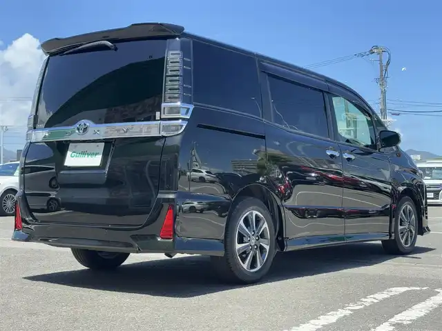 トヨタ ヴォクシー ZS 煌Ⅲ 徳島県 2021(令3)年 3.9万km イナズマスパーキングブラックガラスフレーク ディーラーop10インチナビ/（バックカメラ/フルセグTV/CD/DVD）/純正12インチフリップダウンモニター/両側パワースライドドア/クルーズコントロール/LDA/PKSB/クリアランスソナー/LEDヘッドライト/オートライト/純正16AW/純正フロアマット/ETC2.0/スペアキー