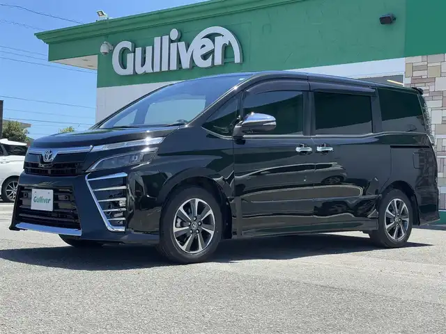 トヨタ ヴォクシー ZS 煌Ⅲ 徳島県 2021(令3)年 3.9万km イナズマスパーキングブラックガラスフレーク ディーラーop10インチナビ/（バックカメラ/フルセグTV/CD/DVD）/純正12インチフリップダウンモニター/両側パワースライドドア/クルーズコントロール/LDA/PKSB/クリアランスソナー/LEDヘッドライト/オートライト/純正16AW/純正フロアマット/ETC2.0/スペアキー