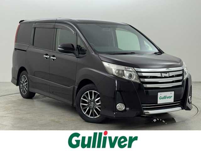 トヨタ ノア Si 福岡県 2014(平26)年 6万km ボルドーマイカメタリック 純正ナビ（フルセグＴＶ、Ｂｌｕｅｔｏｏｔｈ）　/ビルトインＥＴＣ　/バックカメラ　/後席用モニター　/両側パワースライドドア　/横滑り防止装置　/盗難防止システム　/純正１６インチアルミホイール　/ＬＥＤヘッドライト