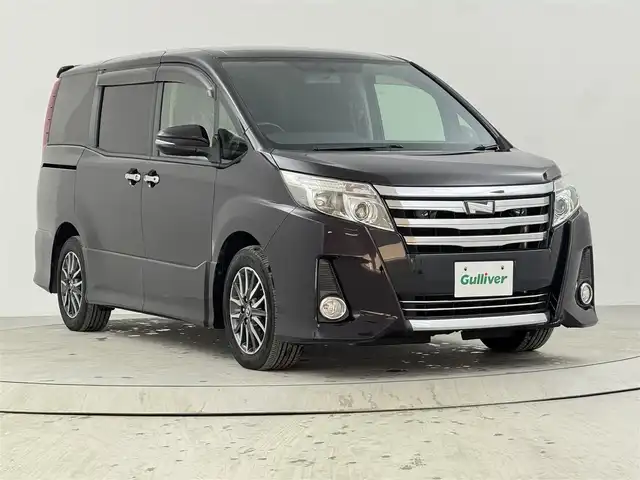 トヨタ ノア Si 熊本県 2014(平26)年 6万km ボルドーマイカメタリック 純正ナビ（フルセグＴＶ、Ｂｌｕｅｔｏｏｔｈ）　/ビルトインＥＴＣ　/バックカメラ　/後席用モニター　/両側パワースライドドア　/横滑り防止装置　/盗難防止システム　/純正１６インチアルミホイール　/ＬＥＤヘッドライト