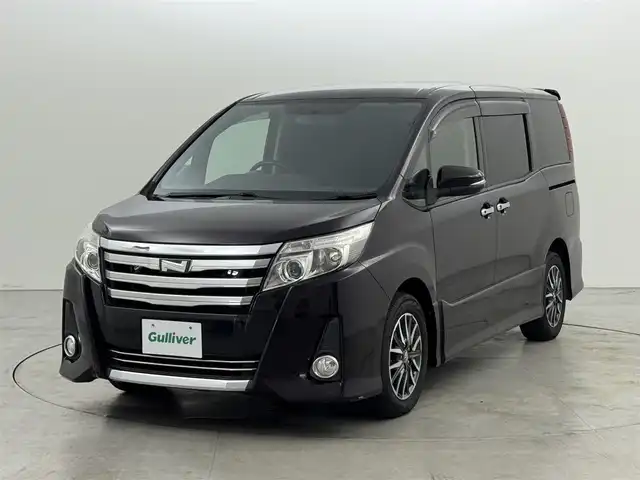 トヨタ ノア Si 福岡県 2014(平26)年 6万km ボルドーマイカメタリック 純正ナビ（フルセグＴＶ、Ｂｌｕｅｔｏｏｔｈ）　/ビルトインＥＴＣ　/バックカメラ　/後席用モニター　/両側パワースライドドア　/横滑り防止装置　/盗難防止システム　/純正１６インチアルミホイール　/ＬＥＤヘッドライト