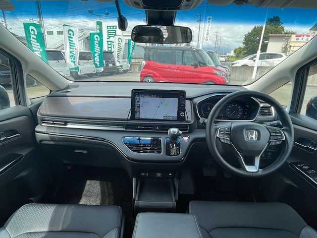 ホンダ オデッセイ ハイブリッド e:HEVアブソルート EX 静岡県 2021(令3)年 4.5万km プレミアムスパークルブラックパール ●純正10インチナビ/(フルセグ/CD/DVD/Bluetooth)/(ギャザズ/VXU-217DYi)/●前席パワーシート/●前席シートヒーター/●全方位カメラ/●レーダークルーズコントロール/●11.6インチフリップダウンモニター/●ブラインドスポットモニター/●衝突被害軽減システム/●レーンキープアシスト/●前後コーナーセンサー/●電動パーキングブレーキ/●オートブレーキホールド/●LEDヘットライト＆フォグランプ/●オートライト/●革巻きステアリング/●ステアリングスイッチ/●ETC2.0/●前後ドライブレコーダー/●両側パワースライドドア/●オットマン/●スマートキー/●プッシュスタート/●ドアバイザー/●純正フロアマット/●純正18インチアルミホイール/●W＋サイド＆カーテンSRS＋ABS