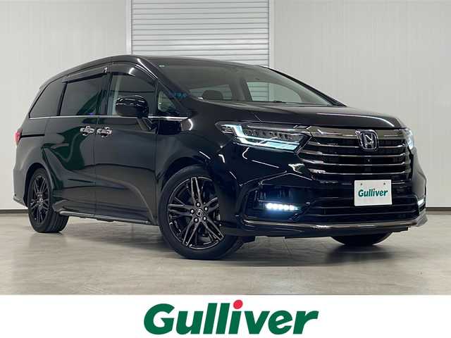 ホンダ オデッセイ ハイブリッド e:HEVアブソルート EX 熊本県 2021(令3)年 4.6万km プレミアムスパークルブラックパール 純正10インチナビ/(フルセグ/CD/DVD/Bluetooth)/(ギャザズ/VXU-217DYi)/前席パワーシート/前席シートヒーター/全方位カメラ/レーダークルーズコントロール/11.6インチフリップダウンモニター/ブラインドスポットモニター/衝突被害軽減システム/レーンキープアシスト/前後コーナーセンサー/電動パーキングブレーキ/オートブレーキホールド/LEDヘットライト＆フォグランプ/オートライト/革巻きステアリング/ステアリングスイッチ/ETC2.0/前後ドライブレコーダー/両側パワースライドドア/オットマン/スマートキー/プッシュスタート/ドアバイザー/純正フロアマット/純正18インチアルミホイール/W＋サイド＆カーテンSRS＋ABS