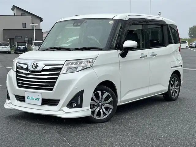 トヨタ ルーミー カスタムG－T 奈良県 2019(平31)年 3.4万km パールホワイトⅢ Panasinic９インチナビ（CN-F1XVD）/（フルセグ／ＢＴ／ＣＤ／ＤＶＤ）/ALPINEフリップダウンモニター/クルーズコントロール/パノラミックビューモニター/プリクラッシュセーフティ/レーンキープアシスト/前後コーナーセンサー/両側パワースライドドア/前席シートヒーター/後席サンシェード/前方ドライブレコーダー/ETC/純正15インチAW/保証書/取り扱い説明書/スペアキーX1