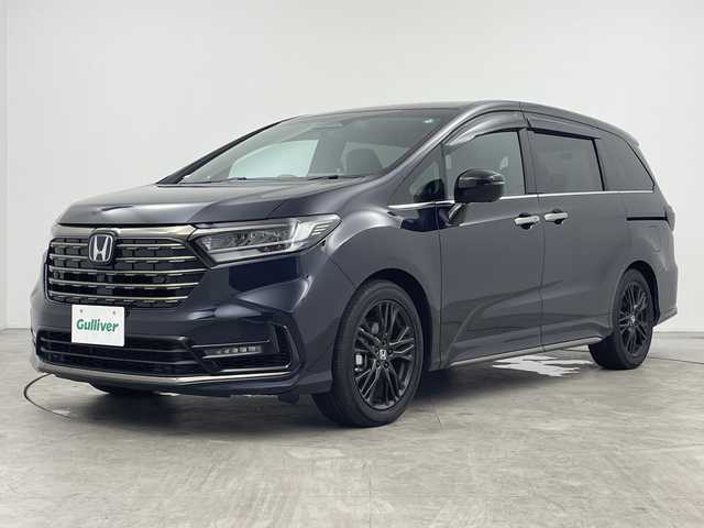 ホンダ オデッセイ ハイブリッド e:HEVアブソルート EXブラックED 三重県 2023(令5)年 0.5万km プレミアムヴィーナスブラックP Gathers11.4インチホンダコネクトナビ（LXM-247VFLi）/・フルセグ・CD・DVD・Bluetooth・SD・USB・HDMI/マルチビューカメラシステム/フリップダウンモニター/オットマン/ホンダセンシング/・衝突軽減ブレーキ/・アダプティブクルーズコントロール/・オートハイビーム/・ブラインドスポットインフォメーション/・車線維持支援システム/・踏み間違い衝突軽減システム/両側パワースライドドア/パワーバックドア/ハンズフリーアクセスパワーテールゲート/1列目・2列目シートヒーター/本革シート/トリプルゾーンコントロール・フルオートエアコンディショナー/ワイヤレス充電器/ビルトインETC/前後ドライブレコーダー/電子制御パーキングブレーキ