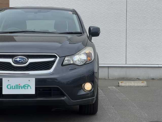 スバル インプレッサ ＸＶ 2．0i 秋田県 2014(平26)年 1.8万km ダークグレーメタリック ４WD/LEDヘッドライト/社外オーディオ（AM/FM/CD）/純正アルミ/リモコンキー/アイドリングストップ/クルーズコントロール/ステアリングスイッチ/MTモード付AT/ETC/パドルシフト/純正フロアマット/純正ドアバイザー/オートライト/オートエアコン/パワーステアリング/パワーウィンドウ/レベライザー/横滑り防止/電動格納ウィンカーミラー/保証書/取扱説明書/記録簿