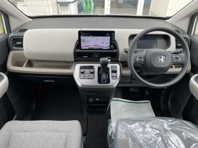 ホンダ フリード AIR 石川県 2024(令6)年 0.9万km パール 純正9型ナビ/フルセグTV/バックカメラ/LEDヘッドライト/両側パワースライドドア/ETC/ホンダセンシング/レーダークルーズ/ドライブレコーダー/スマートキー/プッシュスタート/電動ミラー/保証書