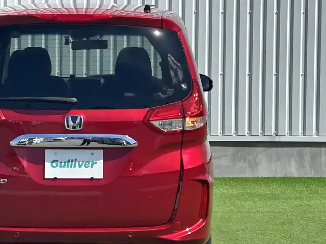 ホンダ フリード G 香川県 2023(令5)年 3.7万km プレミアムクリスタルレッドM 社外９型ナビ　/【CD/DVD/SD/Bluetooth】/地デジ対応TV/バックカメラ/両側電動スライド　/ホンダセンシング　/レーダークルーズコントロール　/ＡＣＣ先行車検知システム　/標識認識機能　/レーンキープアシスト　/社外デジタルインナーミラー　/SDなし/ＬＥＤヘッドライト/オートライト機能/リアロールサンシェード/ウィンカーミラー/ビルトインETC