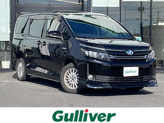 トヨタ ヴォクシー ハイブリッド V 茨城県 2015(平27)年 13.7万km ブラック 純正SDナビ(Bluetooth/バックカメラ/フルセグTV)/LEDオートライト/USB入力端子/スマートキー/ETC/冷房WAC/純正フロアマット/シートヒーター/両側パワースライドドア