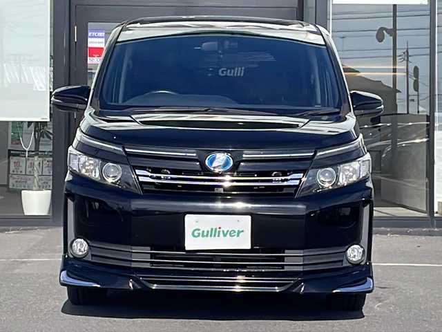 トヨタ ヴォクシー ハイブリッド V 茨城県 2015(平27)年 13.7万km ブラック 純正SDナビ(Bluetooth/バックカメラ/フルセグTV)/LEDオートライト/USB入力端子/スマートキー/ETC/冷房WAC/純正フロアマット/シートヒーター/両側パワースライドドア