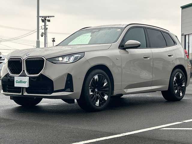 ＢＭＷ ＢＭＷ Ｘ３ 20d xDrive Mスポーツ 佐賀県 2024(令6)年 0.8万km ベージュ 純正14.9インチコントロールディスプレイ/Harman/Kardon/ETC/サラウンドビューカメラシステム/純正20インチアルミホイール/アクティブ・クルーズ・コントロール/ルーフレール/ヘッドアップディスプレイ/パドルシフト/ワイヤレス充電器/パワーバックドア/純正ドライブレコーダー前後/ステアリングヒーター/前席エアシート/全席シートヒーター/前席パワーシート/前席メモリーシート/レザーシート/ブラインドスポットモニター/LEDヘッドライト/スマートキー/スペアキー×１