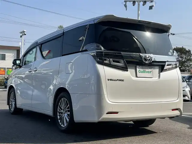トヨタ ヴェルファイア V 愛媛県 2019(令1)年 5.3万km ホワイトパールクリスタルシャイン 禁煙車/登録時走行距離：52224km/ディーラーオプション純正10インチナビ/CD/DVD/フルセグTV/Bluetooth/バックカメラ/３６０°ドライブレコーダー/デジタルインナーミラー/ビルトインETC/純正12.1インチフリップダウンモニター(リモコン有)/サンルーフ/衝突被害軽減システム/クリアランスソナー/横滑り防止装置/レーンキープアシスト/レーダークルーズコントロール/LEDヘッドライト/フォグランプ/オートライト/オートマチックハイビーム/レザーシート/運転席パワーシート/オットマン/両側パワースライドドア/エンジンスタートボタン/スマートキー/純正フロアマット/純正１７インチアルミホイール