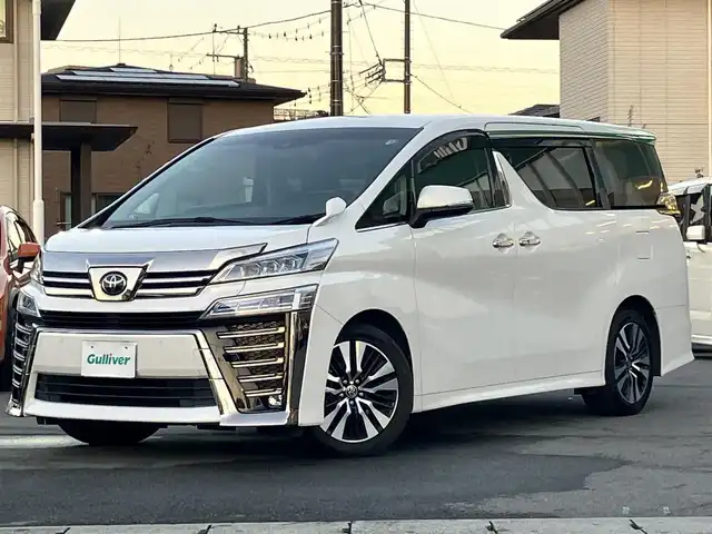 トヨタ ヴェルファイア Z Gエディション 静岡県 2020(令2)年 3.8万km ホワイトパールクリスタルシャイン エンジンスタートボタン/パワーステアリング/パワーウィンドウ/100Ｖ充電/スマートキー/スペアキー1本/Ｗオートエアコン/レーダークルーズコントロール/純正9インチナビ（ＣＤ／ＤＶＤ／ＢＴ／フルセグ）/USB入力端子/ETC2.0/N席電動オットマン/二列目電動オットマン/二列目電動リクライニング/前席パワーシート/電動リアゲート/ドライブレコーダー前後/純正フロアマット/合皮シート/両側パワースライドドア/純正アルミホイール/ABS/横滑り防止装置/コーナーセンサー前後/レーンキープアシスト/盗難防止装置/オートライト/オートマチックハイビーム/三眼LED/W+サイドエアバッグ/カーテンエアバッグ/衝突軽減システム/ステアリングヒーター