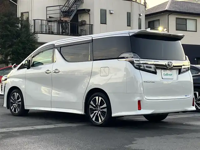 トヨタ ヴェルファイア Z Gエディション 静岡県 2020(令2)年 3.8万km ホワイトパールクリスタルシャイン エンジンスタートボタン/パワーステアリング/パワーウィンドウ/100Ｖ充電/スマートキー/スペアキー1本/Ｗオートエアコン/レーダークルーズコントロール/純正9インチナビ（ＣＤ／ＤＶＤ／ＢＴ／フルセグ）/USB入力端子/ETC2.0/N席電動オットマン/二列目電動オットマン/二列目電動リクライニング/前席パワーシート/電動リアゲート/ドライブレコーダー前後/純正フロアマット/合皮シート/両側パワースライドドア/純正アルミホイール/ABS/横滑り防止装置/コーナーセンサー前後/レーンキープアシスト/盗難防止装置/オートライト/オートマチックハイビーム/三眼LED/W+サイドエアバッグ/カーテンエアバッグ/衝突軽減システム/ステアリングヒーター