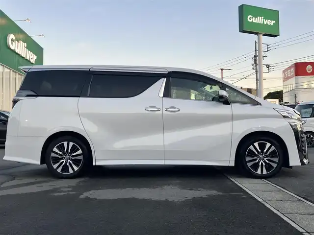 トヨタ ヴェルファイア Z Gエディション 静岡県 2020(令2)年 3.8万km ホワイトパールクリスタルシャイン エンジンスタートボタン/パワーステアリング/パワーウィンドウ/100Ｖ充電/スマートキー/スペアキー1本/Ｗオートエアコン/レーダークルーズコントロール/純正9インチナビ（ＣＤ／ＤＶＤ／ＢＴ／フルセグ）/USB入力端子/ETC2.0/N席電動オットマン/二列目電動オットマン/二列目電動リクライニング/前席パワーシート/電動リアゲート/ドライブレコーダー前後/純正フロアマット/合皮シート/両側パワースライドドア/純正アルミホイール/ABS/横滑り防止装置/コーナーセンサー前後/レーンキープアシスト/盗難防止装置/オートライト/オートマチックハイビーム/三眼LED/W+サイドエアバッグ/カーテンエアバッグ/衝突軽減システム/ステアリングヒーター