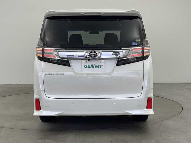 トヨタ ヴェルファイア Z Aエディション 兵庫県 2015(平27)年 8.2万km ホワイトパールクリスタルシャイン ・社外ナビ（AVN-Z04iW）/・AM/FM/CD/DVD/SD/・フルセグTV/・Bluetooth接続/・クルーズコントロール/・両側パワースライドドア/・LEDヘッドライト/・オットマン/・nanoe/・バックカメラ/・クリアランスソナー/・ビルトインETC/・LEDライト&LEDフォグ/・スマートキー/・ステアリングスイッチ/・カーテンエアバッグ/・フロアマット/・18インチアルミホイール/・スタッドレスタイヤ4本付/・取扱説明書