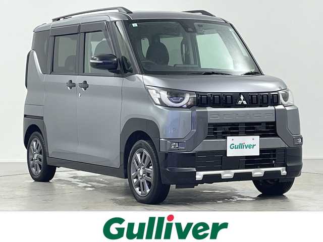 三菱 デリカミニ T プレミアム 岐阜県 2024(令6)年 2.4万km チタニウムグレーメタリック ４WD/ターボ/デジタルインナーミラー/社外ナビ/（CD/DVD/Bluetooth/フルセグ）/全方位カメラ/キックセンサー/両側パワースライドドア/ハーフレザー（シートカバー装着中）/マイパイロット/レーダークルーズコントロール/前方ドライブレコーダー/ビルトインETC/ステアリングヒーター/前席シートヒーター/パドルシフト/スマートキー