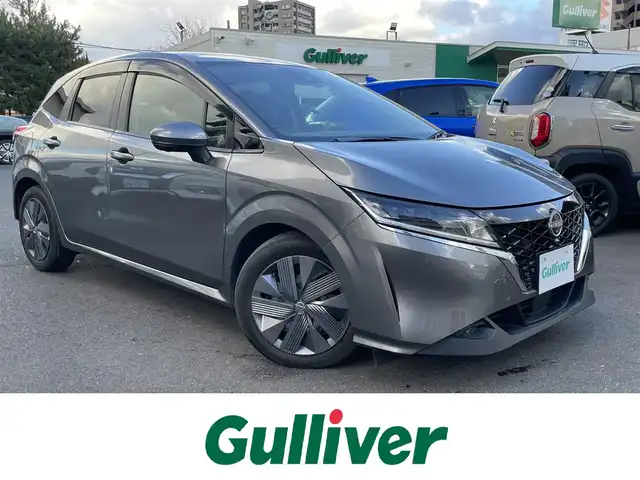 日産 ノート e－パワー X 島根県 2022(令4)年 6.8万km ダークメタルグレー プロパイロット/・レーダークルーズコントロール/・レーンアシスト　/純正９インチメモリナビ　/(AM/FM/フルセグTV/Ｂｌｕｅｔｏｏｔｈ接続)　/全方位／バックカメラ　/ビルトインＥＴＣ2.0　/純正前方ドライブレコーダー　/インテリジェント エマージェンシーブレーキ/アイドリングストップ　/前後コーナーセンサー　/電動パーキングブレーキ/オートハイビーム／ライト/置くだけ充電/純正LEDヘッドライト/純正フロアマット/保証書・取扱説明書（本体＋ナビ）