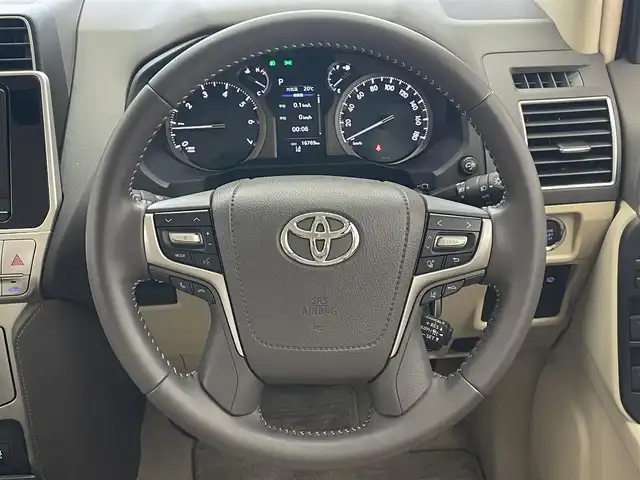 トヨタ ランドクルーザー プラド TX Lパッケージ 愛知県 2022(令4)年 1.7万km ホワイトパールクリスタルシャイン 社外９型ナビ　フルセグＴＶ　バックカメラ　ムーンルーフ　ベージュレザーシート　７人乗　純正エアロ　ブラックルーフレール　シートヒーター　エアシート　純正アルミ　サイドステップ　衝突軽減　ＬＥＤ　禁煙車