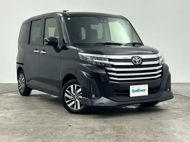 トヨタ ルーミー カスタムG 三重県 2023(令5)年 2.4万km ブラックマイカメタリック 禁煙車/純正ナビ/・AM/FM/Bluetooth/HDMI/iPod/USB/シートヒーター/フルセグ/両側パワースライドドア/クルーズコントロール/TVキャンセラー/バックカメラ/ビルトインETC/LEDヘッドライト/電動パーキング/純正14インチAW