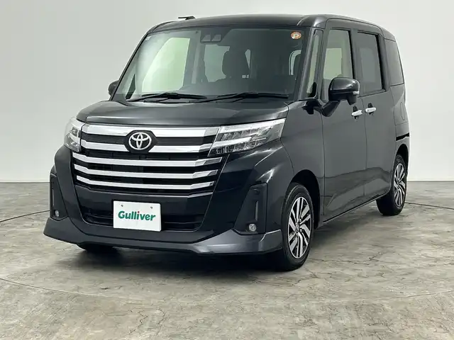 トヨタ ルーミー カスタムG 三重県 2023(令5)年 2.4万km ブラックマイカメタリック 禁煙車/純正ナビ/・AM/FM/Bluetooth/HDMI/iPod/USB/シートヒーター/フルセグ/両側パワースライドドア/クルーズコントロール/TVキャンセラー/バックカメラ/ビルトインETC/LEDヘッドライト/電動パーキング/純正14インチAW