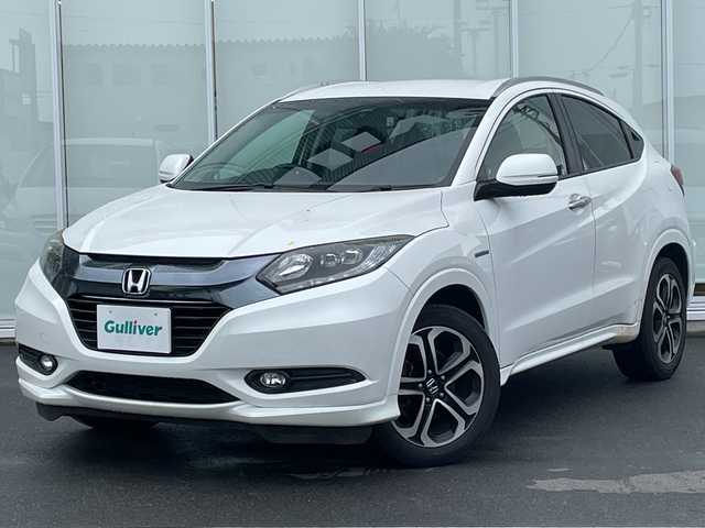 ホンダ ヴェゼル ハイブリッド Z 千葉県 2014(平26)年 8.3万km ホワイトオーキッドパール (株)IDOMが運営する【じしゃロン八千代店】の自社ローン対象車両になります。こちらは現金またはオートローンご利用時の価格です。自社ローンご希望の方は別途その旨お申付け下さい/社外ナビ/フルセグ/CD/DVD/クルーズコントロール　/バックカメラ　/シートヒーター　/ETC　/ドライブレコーダー　/電動パーキング　/LEDヘッドライト　/オートライト　/プッシュスタート/スマートキー/純正フロアマット　/純正アルミホイール　/ABS　/横滑り防止装置/Ｗ＋サイドエアバック/カーテンエアバック