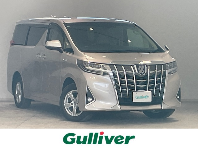 トヨタ アルファードハイブリット X 宮城県 2019(平31)年 3.6万km スティールブロンドM 4WD/トヨタセーフティーセンス/・クリアランスソナー/・パーキングサポートブレーキ/・プリクラッシュセーフティ/・ロードサインアシスト/・車線逸脱警報装置/ALPINE製ディスプレイオーディオ/・Bluetooth/・ビルドインETC/・USB/・バックカメラ/両側パワースライドドア/レーダークルーズコントロール/電子パーキング/・オートブレーキホールド/パワーシート（運転席）/・パワースライドドア（両側）/プッシュスタート/・スマートキー/LEDヘッドライト/・オートライト/・オートハイビーム/純正アルミホイール16インチ