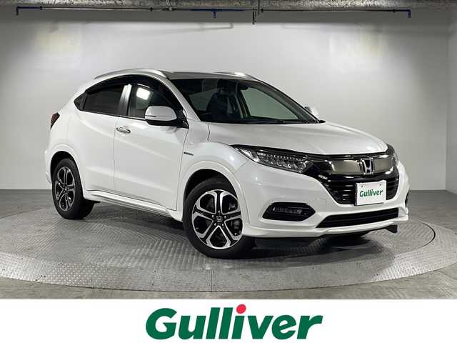 ホンダ ヴェゼル ハイブリッド Z ホンダセンシング 沖縄県 2019(令1)年 5.2万km プラチナホワイトパール 県外仕入れ　/社外ナビ　/フルセグＴＶ　Ｂｌｕｅｔｏｏｔｈ接続　ＣＤ　ＤＶＤ再生　/バックカメラ　/ＥＴＣ　/クルーズコントロール　/レーンアシスト　/パドルシフト/ハーフレザー　/シートヒーター/スマートキー/スペアキー/ＬＥＤヘッドライ　/オートライト/純正アルミホイール/純正フロアマット