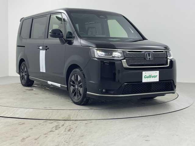 ホンダ ステップワゴン スパーダ eHEV 熊本県 2025(令7)年 0.1千km クリスタルブラックパール 登録済未使用車/純正ナビLXM-247VFLi（ＣＤ・ＤＶＤ・フルセグ・ＢＴ・ＳＤ・ＵＳＢ）/バックカメラ　/両側パワースライドドア　/前席シートヒーター　/ホンダセンシング/・衝突軽減ブレーキ/・レーンキープアシスト/・レーダークルーズコントロール/・踏み間違い防止/・標識認識機能/・後方誤発進抑制機能/・近距離衝突軽減ブレーキ/・車線維持支援システム/・歩行者事故低減ステアリング/・先行車発進お知らせ/・ブラインドスポットモニター/・路外逸脱抑制機能/横滑り防止　/前後クリアランスソナー/パワーバックドア/パドルシフト/オートブレーキホールド/ハーフレザーシート/純正１６インチAW/オートライト/LEDヘッドライト/フォグライト/スマートキー/プッシュスタート/スペアキー1本/保証書/取扱説明書　