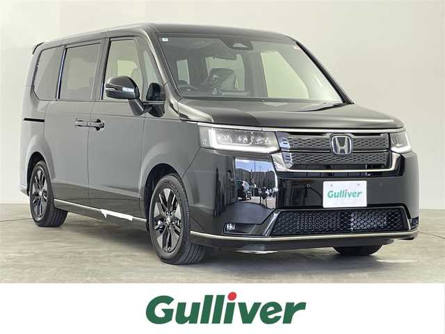 ホンダ ステップワゴン スパーダ eHEV 千葉県 2025(令7)年 0.1千km クリスタルブラックパール 15.6インチ リア席モニター /HondaSENSING/・衝突軽減ブレーキ（CMBS）/・先行車発進お知らせ機能/・歩行者事故低減ステアリング/・路外逸脱抑制機能/・標識認識機能/・渋滞追従機能付アダプティブクルーズコントロール/・車線維持支援システム（LKAS）/・トラフィックジャムアシスト（渋滞運転支援機能）/・ブラインドスポットインフォメーション/・誤発進抑制機能/・後方誤発進抑制機能/・近距離衝突軽減ブレーキ/・急アクセル抑制機能/・パーキングセンサーシステム/・オートハイビーム/純正11.4インチメモリーナビ/・フルセグTV/・Bluetooth接続/・CD/DVD再生/・SD/MSV/・バックカメラ/両側パワースライドドア/LEDヘッドライト/コーナーセンサー/スマートキー/サイド/カーテンエアバッグ