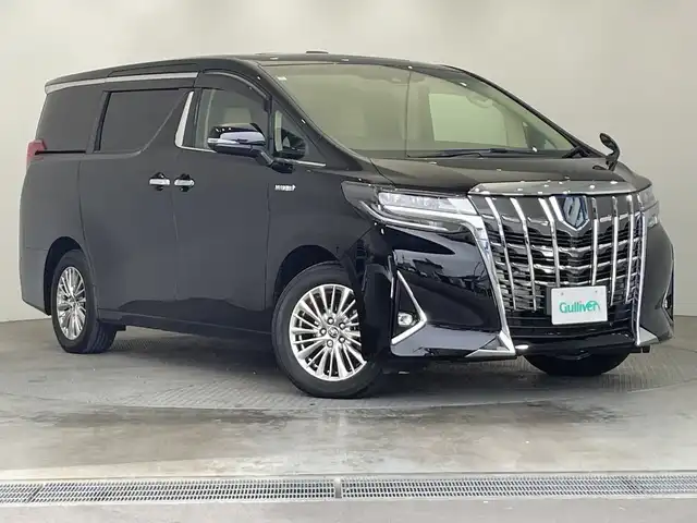 トヨタ アルファードハイブリット G Fパッケージ 栃木県 2018(平30)年 2.5万km ブラック 純正ナビ/(フルセグTV・Bluetooth・CD・DVD・Blu-ray・USB・AUX)/JBLプレミアムサウンド/バックカメラ/サンルーフ/トヨタセーフティセンス/ ・プリクラッシュセーフティ/ ・レーンキープアシスト/ ・オートクルーズコントロール/ ・オートハイビーム/前後コーナーセンサー/パワーバックドア/本革シート(ベージュ)/前席パワーシート(運転席メモリ機能付き)/二列目シート電動リクライニング/オットマン/前席シートクーラー/前席・二列目シートヒーター/オートホールド/ウッドコンビハンドル/両側パワースライドドア/AC100V電源/MTモード付AT/純正アルミホイール/純正フロアマット/スマートキー/スペアキー1本/取扱説明書/保証書