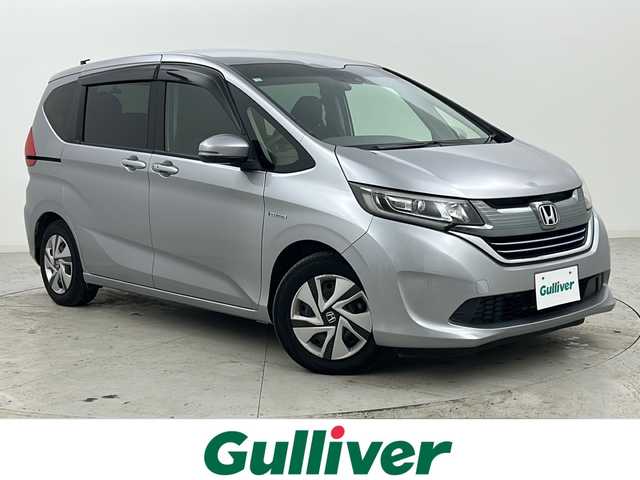 ホンダ フリード ハイブリット G ホンダセンシング 宮城県 2018(平30)年 6万km ルナシルバーM 禁煙車/ホンダセンシング/・衝突軽減ブレーキ/・路外逸脱抑制機能/・先行車発進お知らせ機能/・アダプティブクルーズコントロール/・車線維持支援システム/・標識認識機能/両側パワースライドドア/バックカメラ/純正9インチSDナビ/・BT/SD/DVD/CD/AM/FM/フルセグTV/純正ドライブレコーダー（F/R）/ビルトインETC/ステアリングスイッチ/プッシュスタート/スマートキー/LEDヘッドライト/純正フロアマット/純正15インチホイールキャップ/後席ロールサンシェード/ドアバイザー/横滑り防止装置/アイドリングストップ