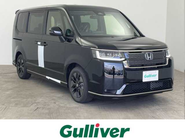 ホンダ ステップワゴン スパーダ eHEV 大分県 2025(令7)年 0.1万km未満 黒 ホンダセンシング/・衝突軽減ブレーキ/・誤発進抑制機能/・後方誤発進抑制機能/・近距離衝突軽減ブレーキ/・歩行者事故低減ステアリング/・路外逸脱抑制機能/・渋滞追従機能付アダプティブクルーズコントロール/・車線維持支援システム/・トラフィックジャムアシスト/・先行車発進お知らせ機能/・標識認識機能/・アダプティブドライビングビーム/ディーラーOP11.4インチナビ/（CD/DVD/SD/MSV/フルセグ/USB/AppleCarPlay/AndroidAuto）/ビルトインETC/両側パワースライドドア/パワーテールゲート/ハーフレザーシート/シートヒーター（D/N席）/ブラインドスポットモニター/電動パーキングブレーキ/オートブレーキホールド/パドルシフト/LEDフォグランプ/純正16インチアルミホイール/リアサンシェード/全列USBチャージャー/純正フロアマット/純正ドアバイザー/スマートキー/プッシュスタート/保証書・取扱説明書/スペアキー