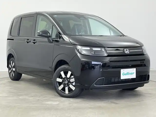 ホンダ フリード ハイブリット e:HEV AIR EX 新潟県 2025(令7)年 0.1千km クリスタルブラックパール 4WD/純正メモリナビ/　フルセグTV/Bluetooth/AppleCarPlay/Androiduto/レーダークルーズコントロール/衝突被害軽減ブレーキ/レーンキープアシスト/ブラインドスポットインフォメーション/踏み間違い衝突軽減システム/前後コーナーセンサー/両側パワースライドドア/前席シートヒーター/バックモニター/オートマチックハイビーム/LEDヘッドライト/オートライト/横滑り防止装置/レザーステアリング/ステアリングスイッチ/禁煙車