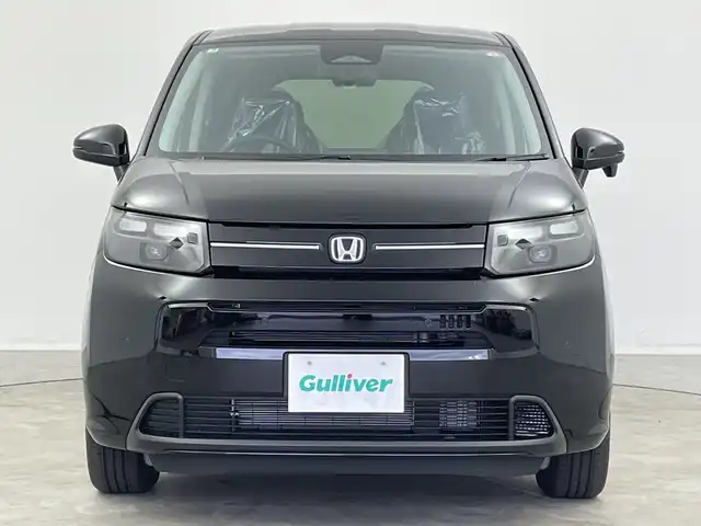 ホンダ フリード ハイブリット e:HEV AIR EX 新潟県 2025(令7)年 0.1千km クリスタルブラックパール 4WD/純正メモリナビ/　フルセグTV/Bluetooth/AppleCarPlay/Androiduto/レーダークルーズコントロール/衝突被害軽減ブレーキ/レーンキープアシスト/ブラインドスポットインフォメーション/踏み間違い衝突軽減システム/前後コーナーセンサー/両側パワースライドドア/前席シートヒーター/バックモニター/オートマチックハイビーム/LEDヘッドライト/オートライト/横滑り防止装置/レザーステアリング/ステアリングスイッチ/禁煙車