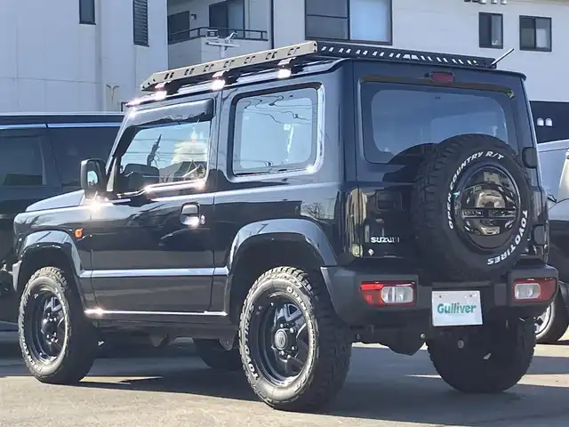 スズキ ジムニー XG 静岡県 2020(令2)年 1.7万km ブルーイッシュブラックパール3 ワンオーナー/ＳＤナビ（CD/DVD/BT/フルセグ）/バックカメラ/ドアバイザー/社外ルーフラック/社外グリル　LEDポジションライト/ホワイトレタータイヤ（TOYOタイヤ）/ETC/ドライブレコーダー前後/パワーウィンドウ/パワーステアリング/４WD/リモコンキー/マニュアルエアコン/USB入力端子/布シート/社外フロアマット/社外アルミホイール/背面タイヤ/ABS/横滑り防止装置/センターデフロック/レーンキープアシスト/盗難防止装置/オートライト/オートマチックハイビーム/ダウンヒルアシストコントロール/ハロゲン/Wエアバッグ/衝突軽減システム/ボンネットダンパー付き/バッグドア社外ダンパー