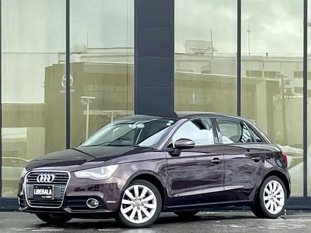 アウディ Ａ１ スポーツバック 1．4TFSI 石川県 2012(平24)年 6.5万km シラーズレッドメタリック アドバンスドキー/純正MMIナビ/フルセグTV/Bluetooth/ETC/ハーフレザースポーツシート/スポーツサスペンション/HIDヘッドライト/オートライト/LEDテールライト/LEDインテリアライト/スマートキー/プッシュスタート/アイドリングストップ